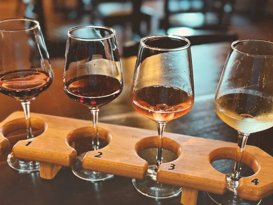 Four glasses on a wine tasting board — serving suggestion