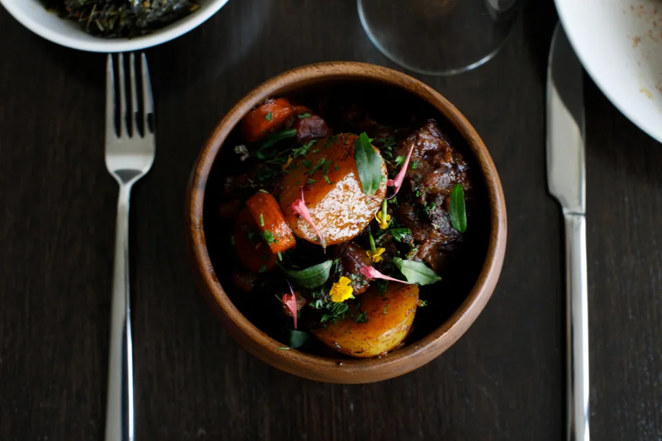 Potjie oxtail in a ceramic bowl